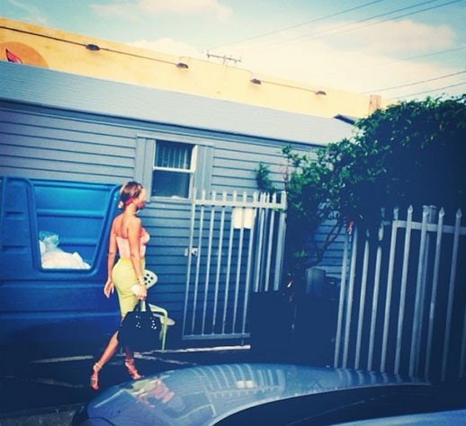 Beyonce completed her look with colorful Jil Sander sandals and a black Dsquared2 Quebec bag