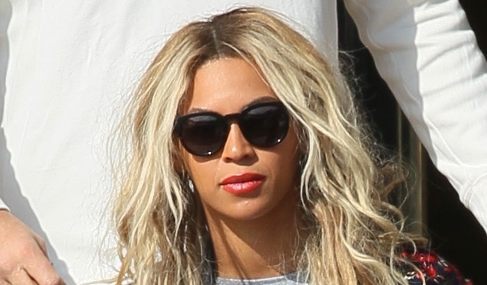 Beyonce covers her eyes with a large pair of sunglasses during a shopping trip