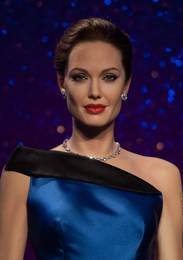 Close-up of Angelina Jolie's wax figure in a stunning blue gown at Madame Tussauds