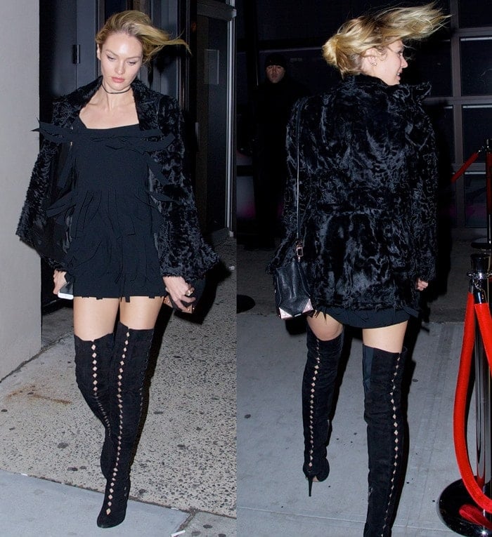 Candice Swanepoel wears a black mini dress and a black coat