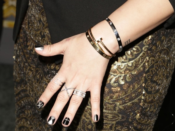 Demi Lovato showing off her Cartier love bracelet