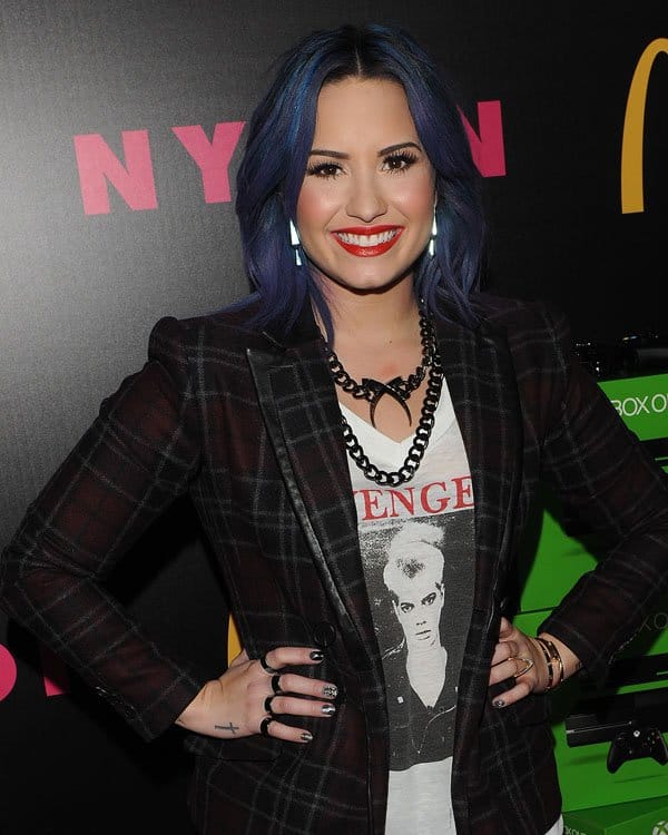 Demi Lovato rocking a plaid jacket from Isabelli Addington at the Nylon magazine celebration