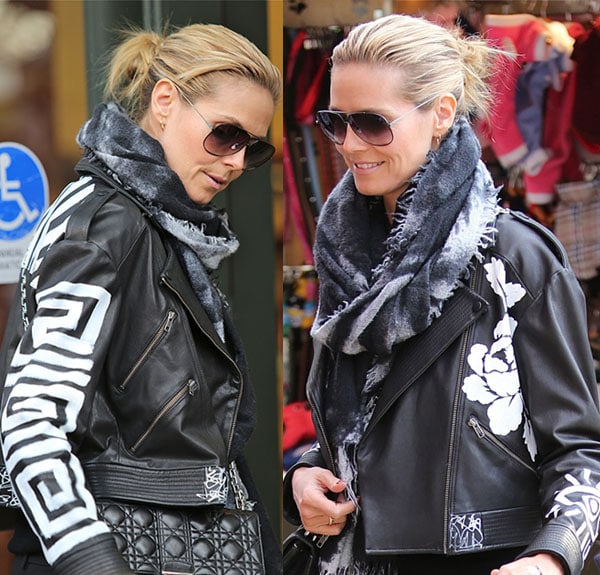 Heidi Klum showcases her edgy style in a hand-painted Elizabeth and James leather jacket paired with a cozy scarf at The Grove