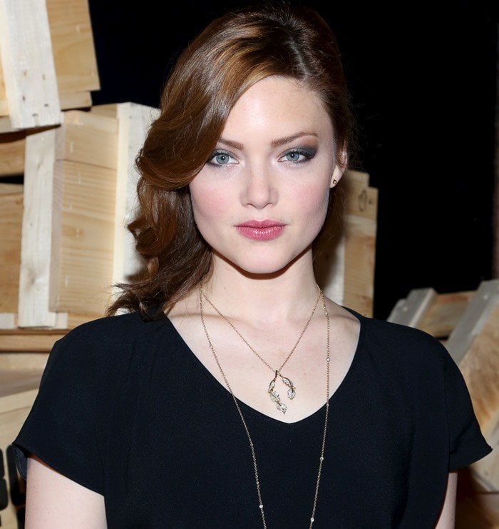 Holliday Grainger wears her red hair down and curled at the Bonnie & Clyde premiere party