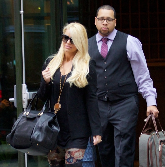 Jessica Simpson steps out in New York City on December 5, 2013, wearing Jean Paul Gaultier floral leggings, Yves Saint Laurent thigh-high boots, and a Chloe Alice satchel bag