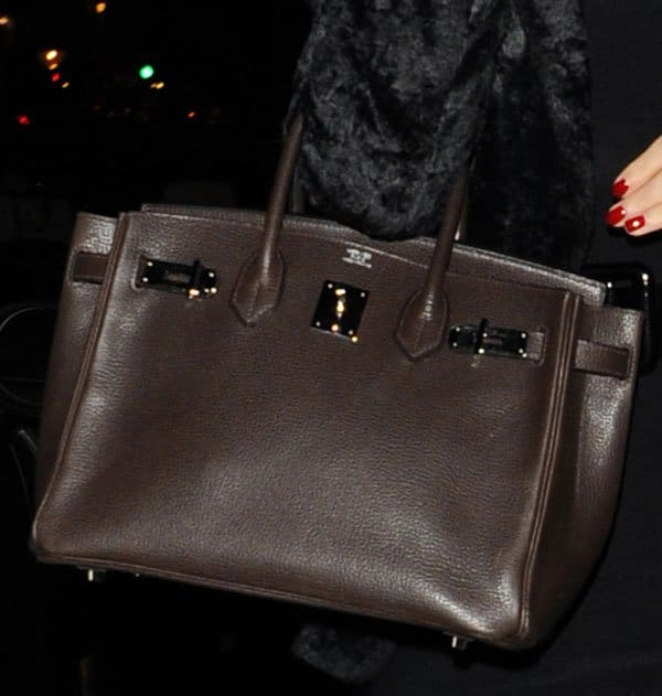 Katy Perry carrying a brown Hermès Kelly bag