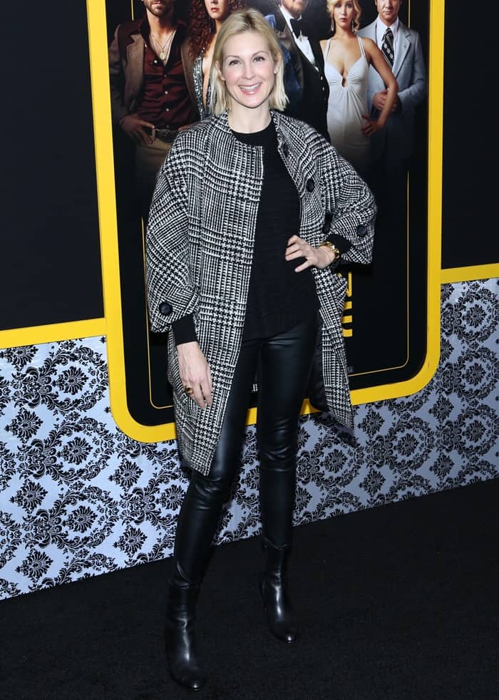 Kelly Rutherford wears a black-and-white patterned coat over black leather pants at an "American Hustle" screening