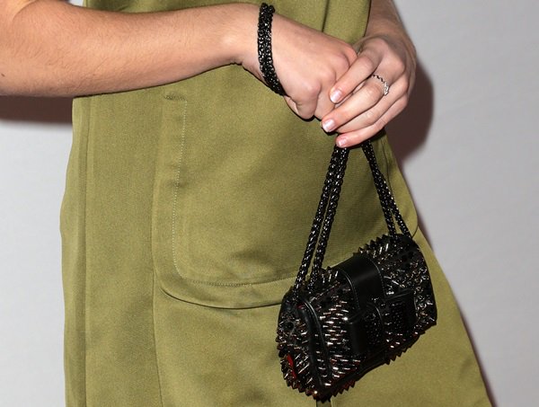 Kiernan Shipka toting a Christian Louboutin "Sweet Charity" studded shoulder bag