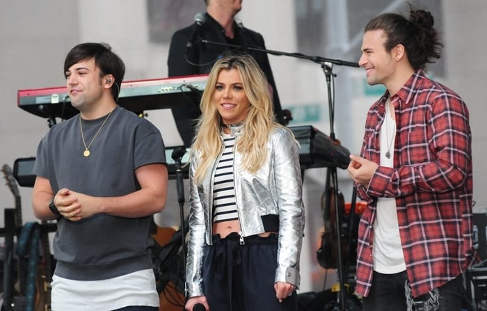 The Band Perry siblings, Reid, Kimberly, and Neil Perry, performing together and showcasing their distinctive casual style