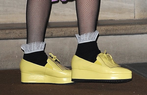 Lady Gaga styled her yellow shoes with black shoes and stockings