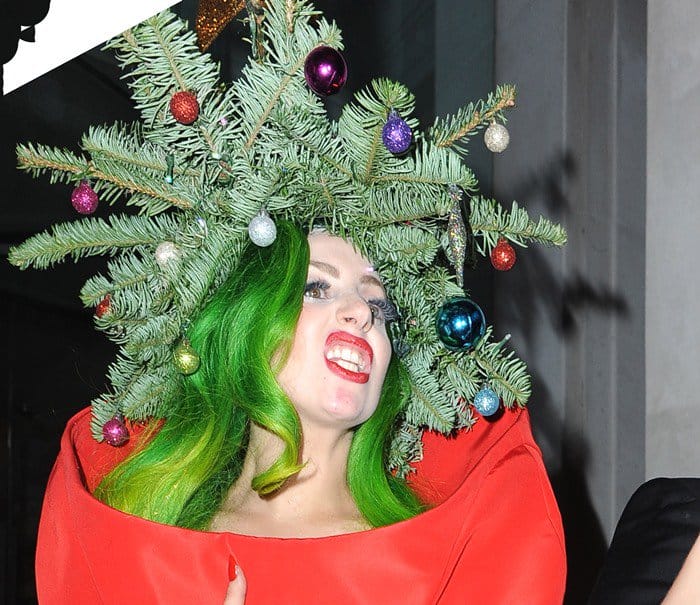 Lady Gaga wears a pine tree as a hat with a gold star on top
