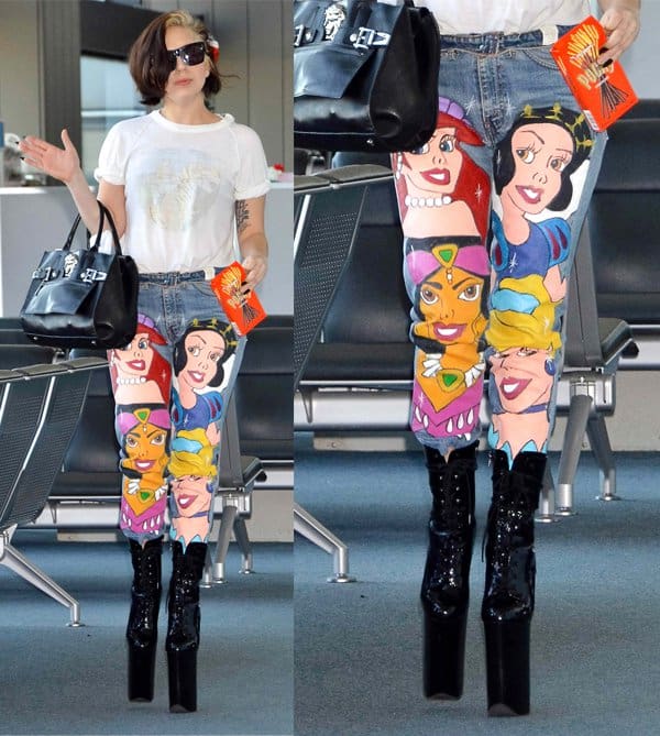 Lady Gaga wears Disney jeans featuring the faces of Snow White, Princess Aurora, Princess Jasmine, and Princess Ariel