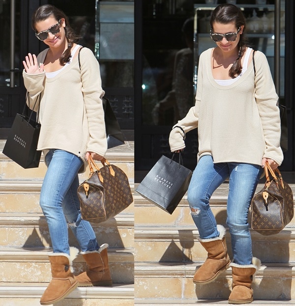 Lea Michele with her hands full as she leaves Barneys New York in Beverly Hills after shopping on October 7, 2011