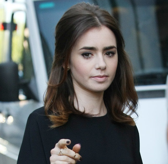 Lily Collins leaving the ITV Studios wearing a structured dress