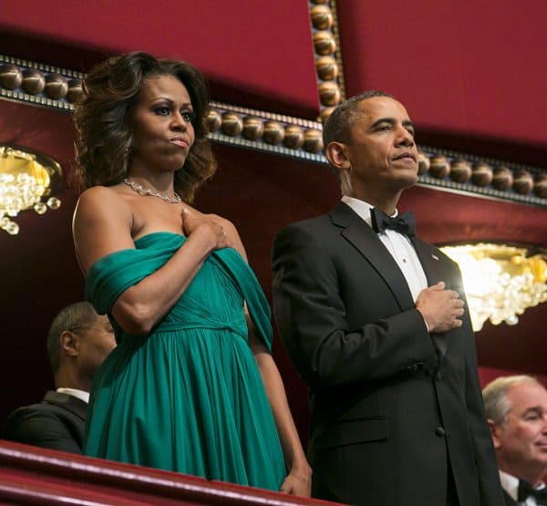 Michelle Obama exudes elegance in an emerald green Marchesa gown as she stands with President Barack Obama at the 2013 Kennedy Center Honors