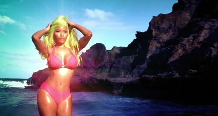 Pink bikini-clad electric green-haired Nicki Minaj in the opening scene of Starships filmed on the island of Kauaʻi in Hawaii