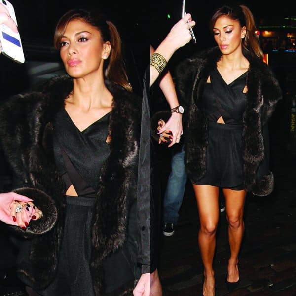 Nicole Scherzinger was seen looking effortlessly stylish in a Finder Keepers Like Smoke playsuit paired with a Dom Goor black hooded shearling jacket, showcasing her ability to mix high-end and casual clothing