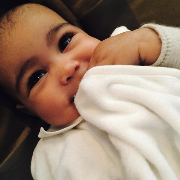 North West, daughter of Kim Kardashian and Kanye West, adorably cuddles her blanket in this precious snapshot