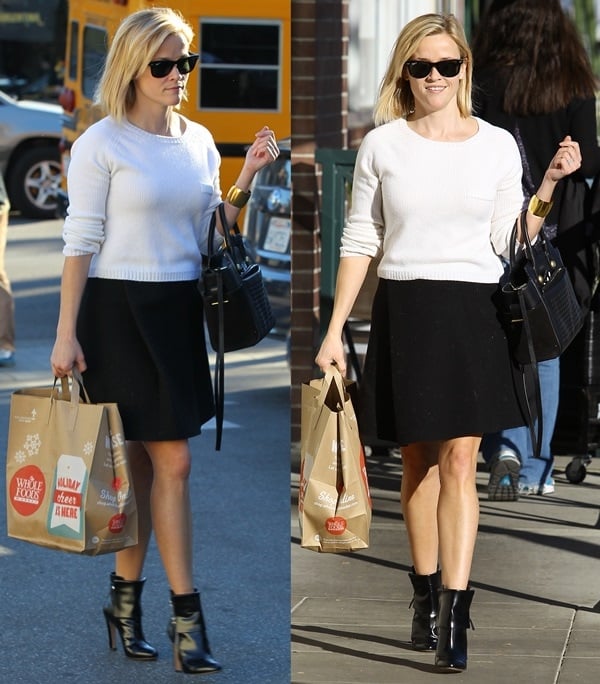 Reese Witherspoon wore a pair of Gianvito Rossi leather booties, perfectly paired with a short black skirt and a white knit cropped sweater