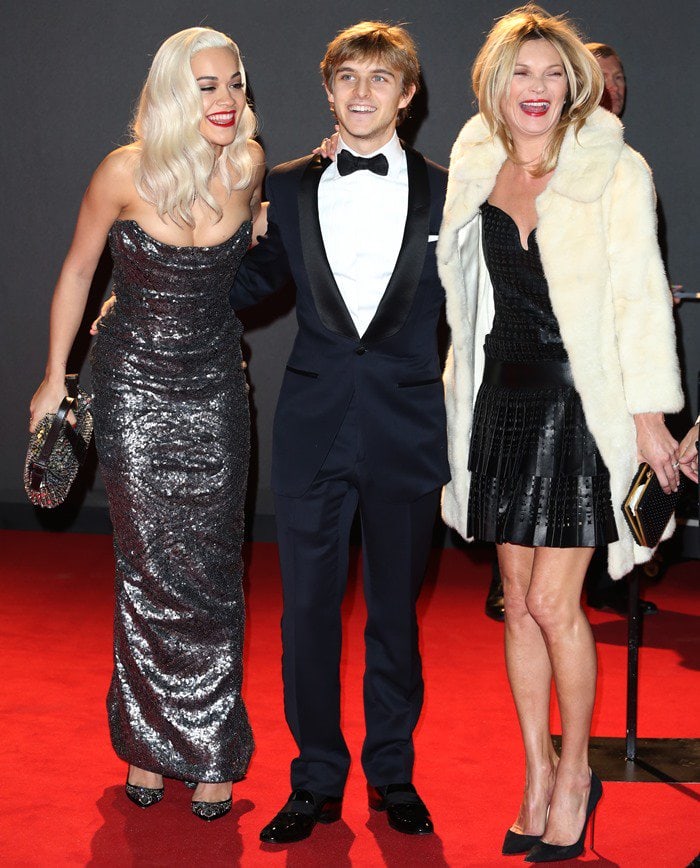 Rita Ora, Brandon Green and Kate Moss pose for photos on the red carpet of the British Fashion Awards