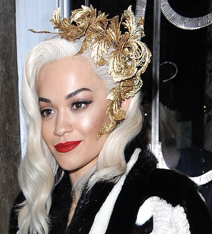 Rita Ora wears a headpiece from Philip Treacy