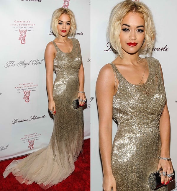 Rita Ora commands attention in a shimmering gold Donna Karan Atelier gown at the Angel Ball 2013, effortlessly outshining the models in attendance — photographed on October 29, 2013, in New York City