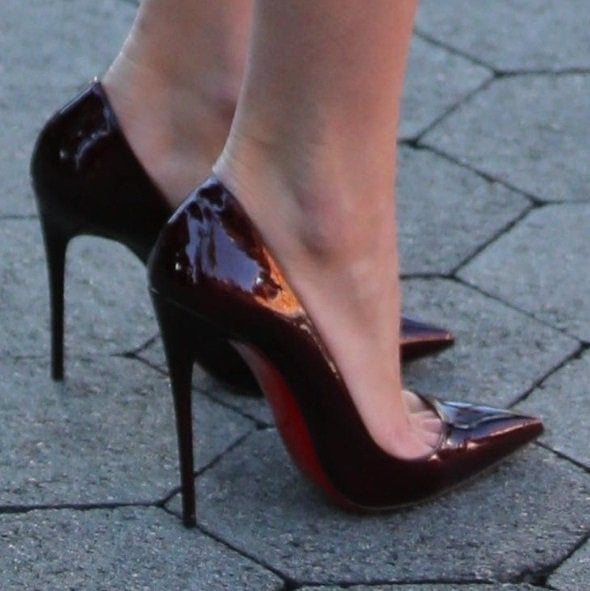 Candice Swanepoel showing off her legs in Christan Louboutin "So Kate" pumps