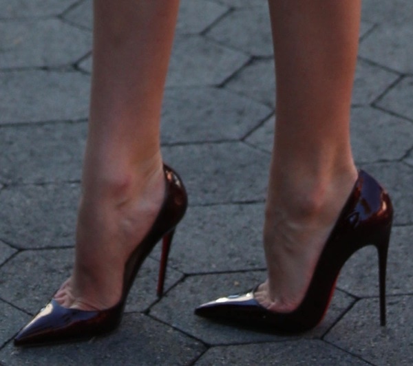 Candice Swanepoel showing off her legs in Christan Louboutin "So Kate" pumps
