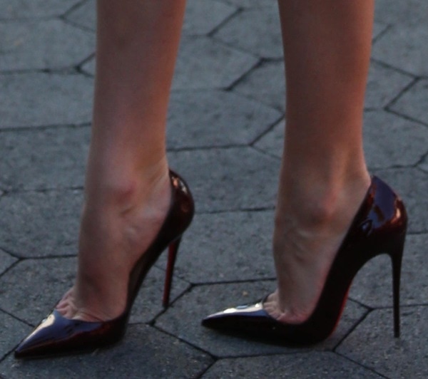 Candice Swanepoel showing off her legs in Christan Louboutin "So Kate" pumps