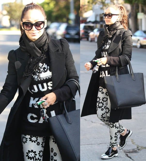 Cara Santana rocks a stunning black-and-white outfit with her black scarf