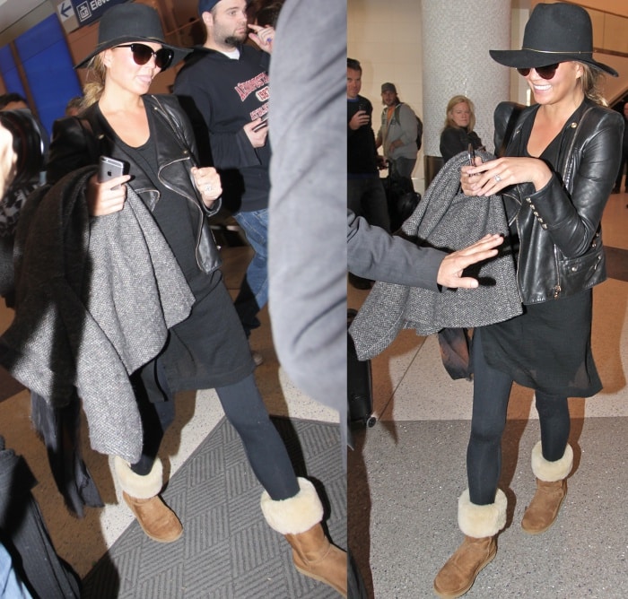 Chrissy Teigen wearing Ugg boots with jeans