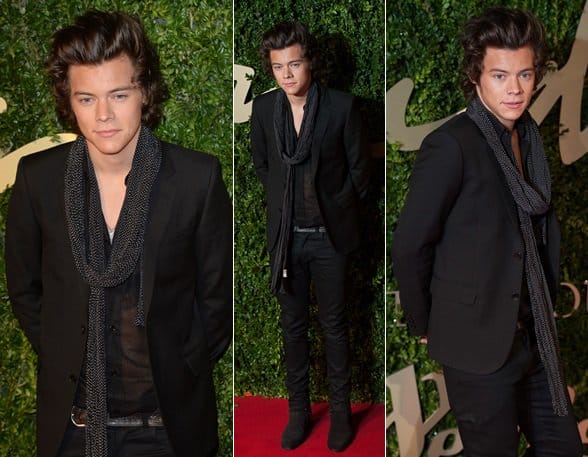 Fashion Forward: Harry Styles pairs a sheer button-down shirt with a chic black dotted scarf, a statement blend of sophistication and style