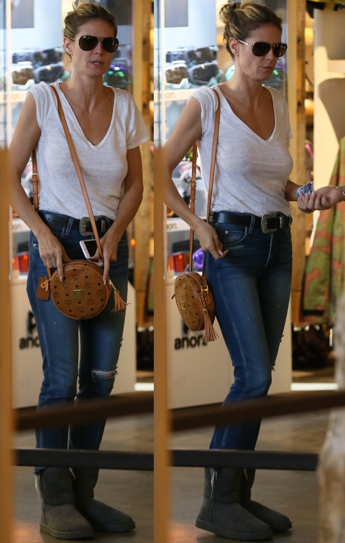 Heidi Klum shopping in grey UGG Classic Short boots and Amo Babe high rise crop jeans in Beverly Hills