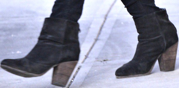 Katie Holmes opted for ankle boots featuring chunky stacked heels that add both height and stability