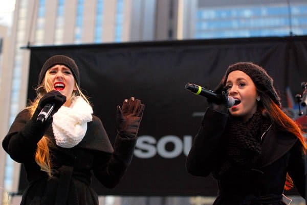 Megan and Liz, a musical duo consisting of identical twins Megan and Liz Mace, kept warm in gorgeous scarves