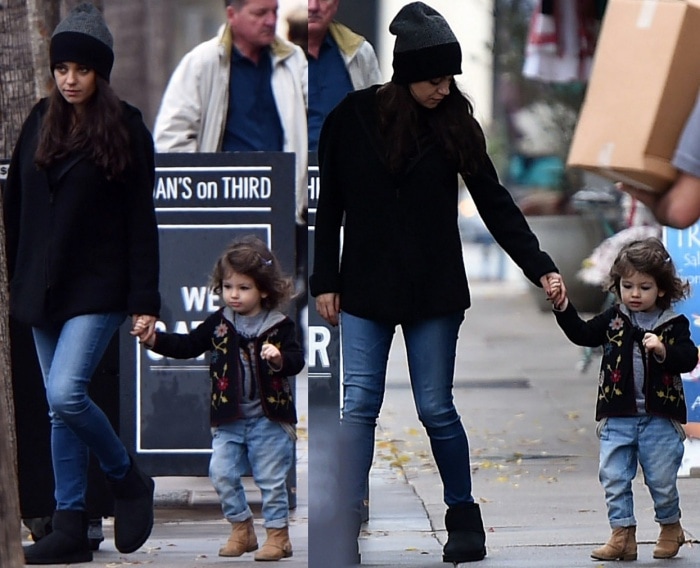 Mila Kunis and her daughter Wyatt Kutcher were spotted leaving Joan’s on Third in Los Angeles, California, on December 23, 2016. Mila kept it cozy in a black hooded sweater, jeans, and black UGG boots, while Wyatt looked adorable in a floral jacket, faded jeans, and tan boots