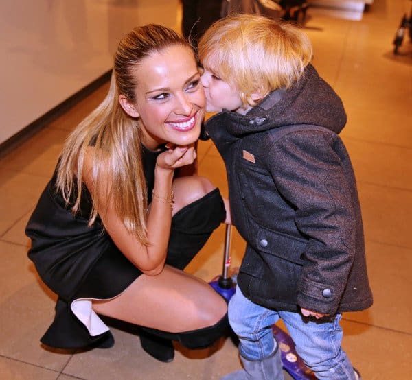 Heartwarming moment: Petra Němcová receiving a kiss from a young admirer