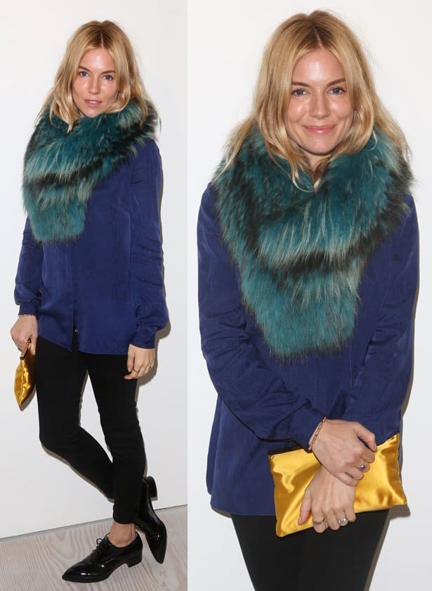 Sienna Miller wears a blue blouse with her green fur scarf, but tones down the mix by using classic black trousers and oxfords