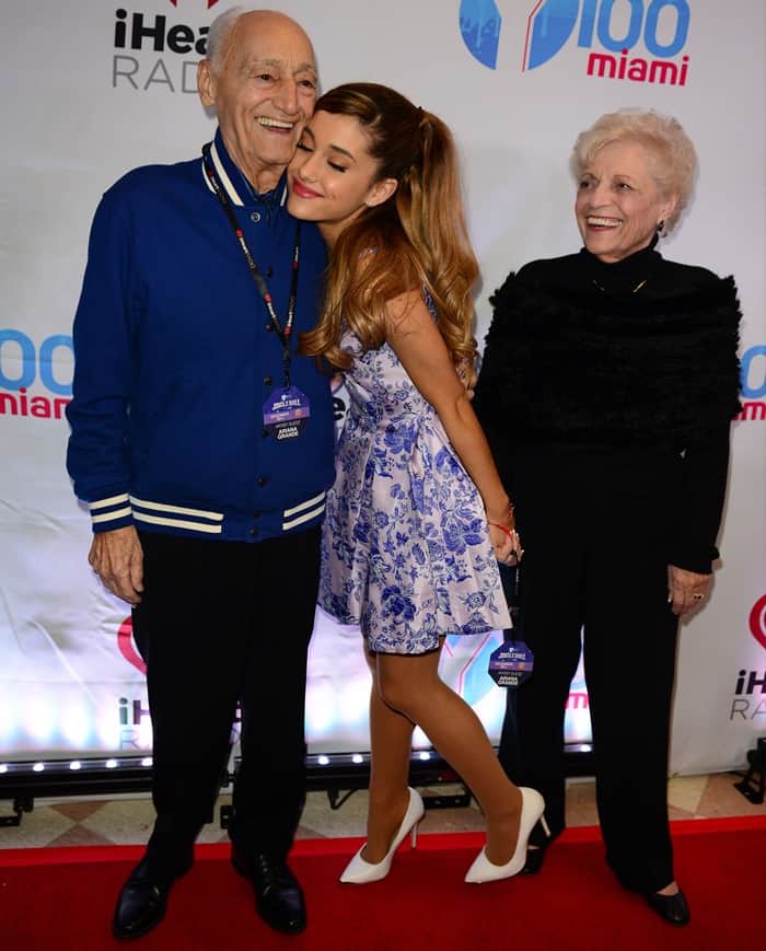 Ariana Grande poses with her grandparents, Frank Anthony Grande and Marjorie "Nonna" M. Grande, at the Y100 Jingle Ball