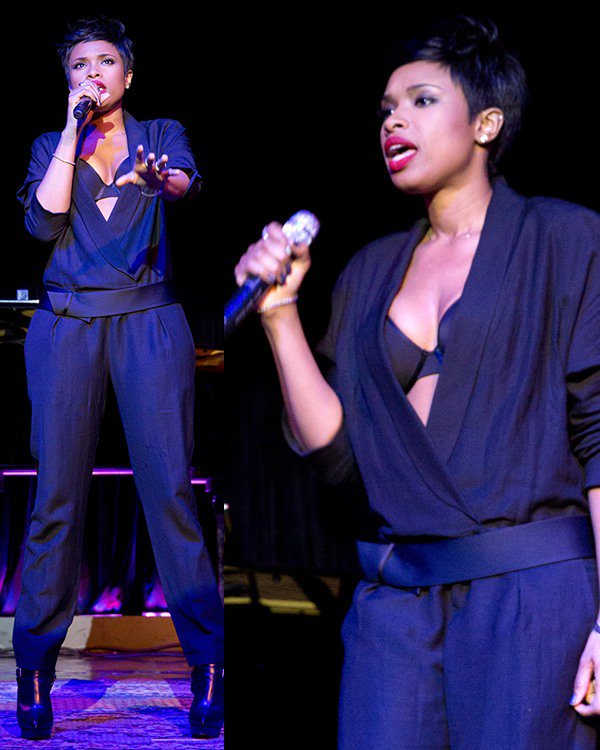 Jennifer Hudson wearing an Isabel Marant draped jumpsuit that features long sleeves, a plunging V-neckline, a snap-on satin cummerbund, and pleated pants