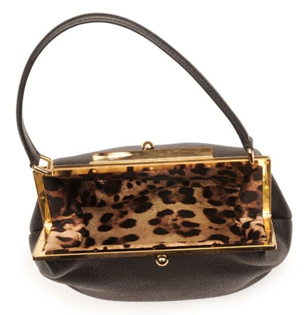 Golden hardware structures this Dolce & Gabbana bag's classic frame top, countered by the soft slouch of pebbled calfskin