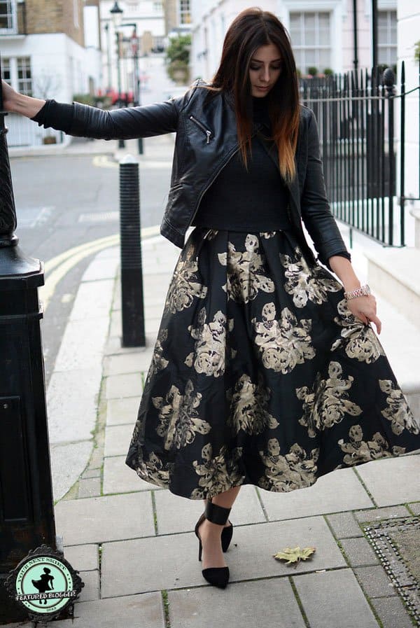 Emma looked lovely in a gold-and-black skirt with a black leather jacket