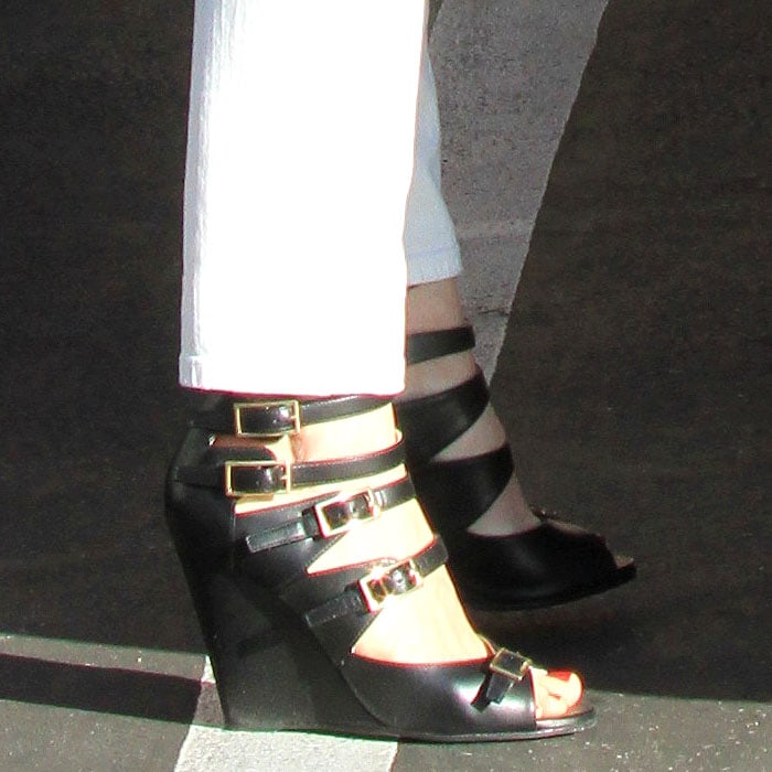 January Jones wearing multibuckled Arce" wedge sandals by Chloé