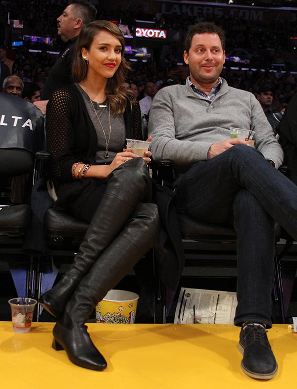 Jessica Alba and Michael Kives enjoying the Los Angeles Lakers vs. Denver Nuggets game courtside at the Staples Center in Los Angeles on January 5, 2014