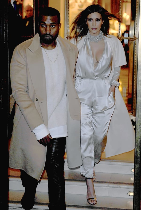 Kim Kardashian exits her hotel during Paris Fashion Week with husband Kanye West