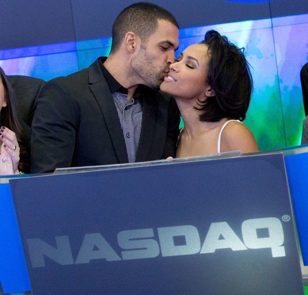 New Year's Eve party hosts Kat Graham and fiancé Cottrell Guidry ringing the closing bell at Nasdaq MarketSite in New York City on December 31, 2013