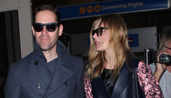 Kate Bosworth wears her hair down as she arrives at Los Angeles International Airport with husband Michael Polish