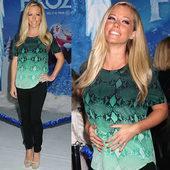 Kendra Wilkinson cradles her baby bump in skinny jeans at the Frozen world premiere