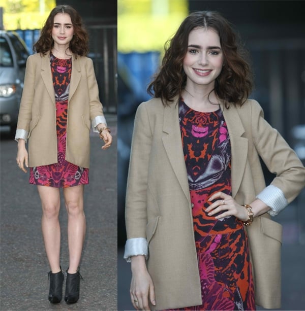 Lily Collins adds dimension to her figure-hugging dress with a boxy blazer at the ITV Studios in London, England, enhancing her silhouette on June 3, 2013