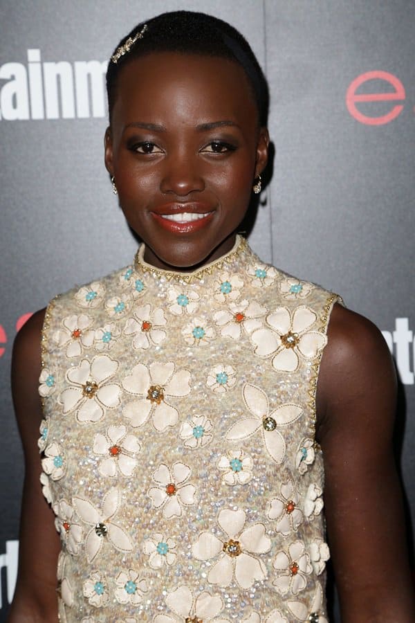 Lupita Nyong'o stuns in a vintage Valentina dress with beautiful beadwork and floral details at Entertainment Weekly's Screen Actors Guild Party at Chateau Marmont in Los Angeles on January 17, 2014